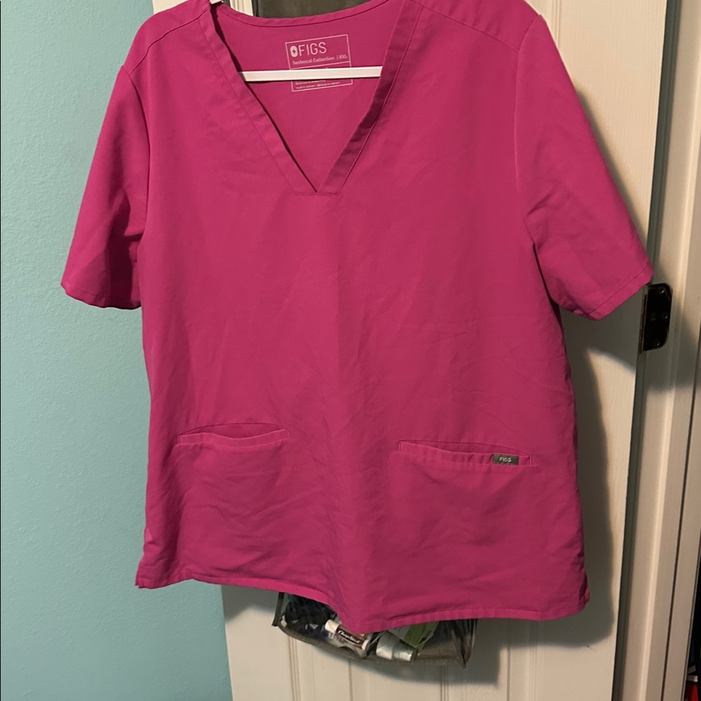 Figs scrubs in hot pink.
